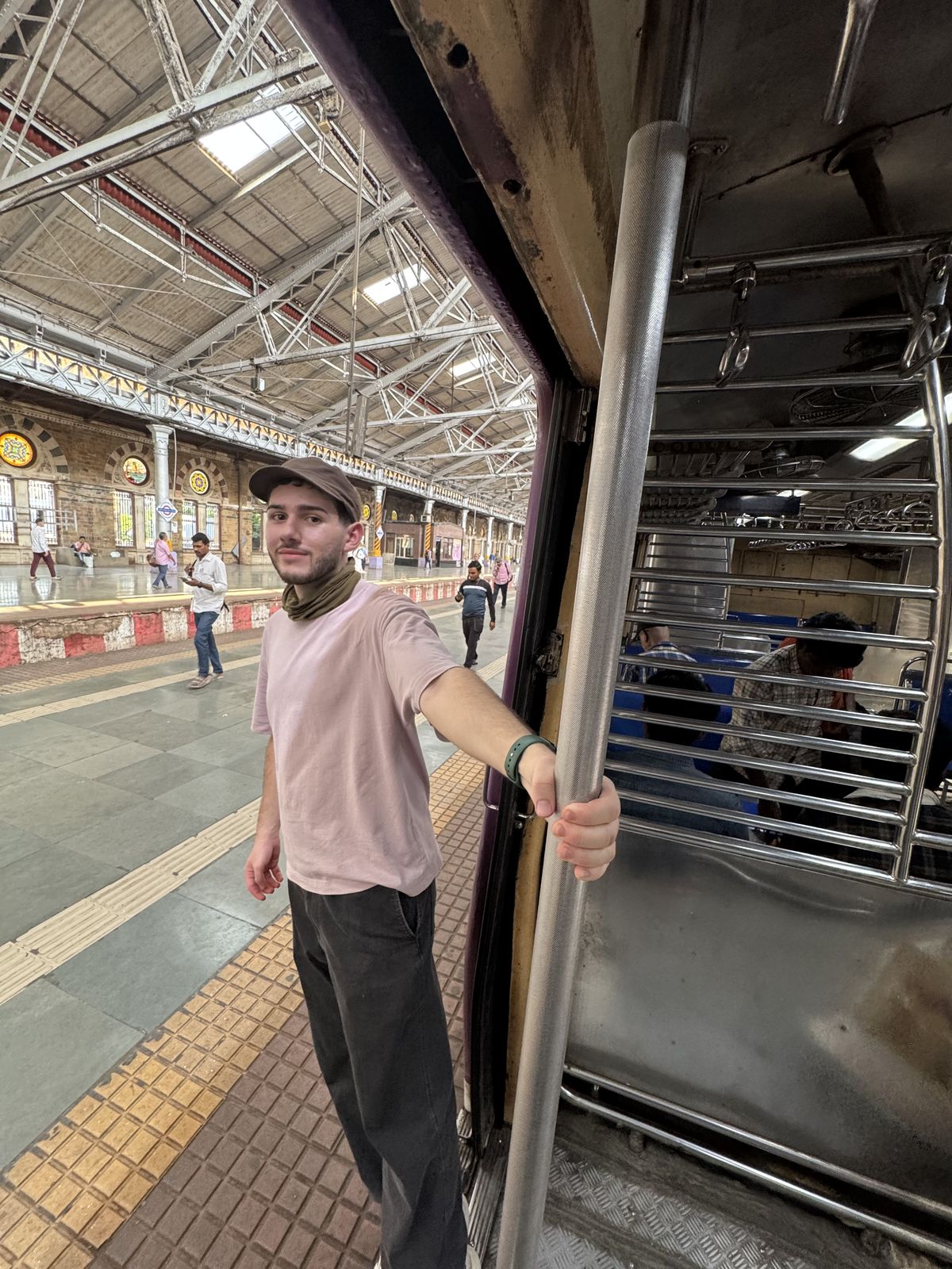 At the train door, the way Mumbaikars ride